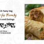 Promotional banner for Aligarh Tasty Veg: 'Dinners and Outings' with veggie wraps on the right and a contact number on the left area.